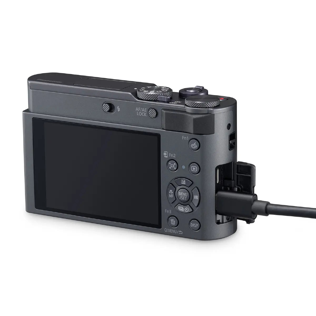 Black digital camera with a cable attached on a white background
