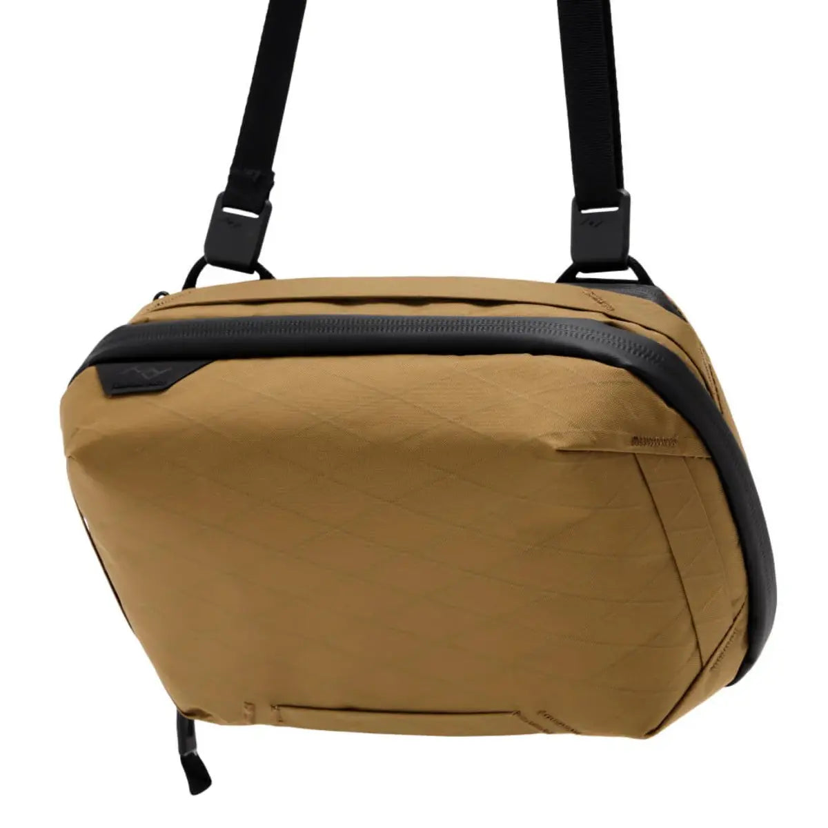 Brown shoulder bag with black straps on a white background