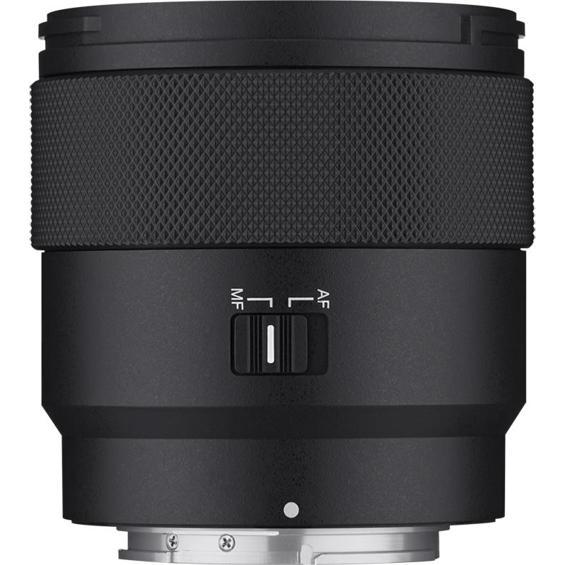 Black camera lens with control switches on a white background