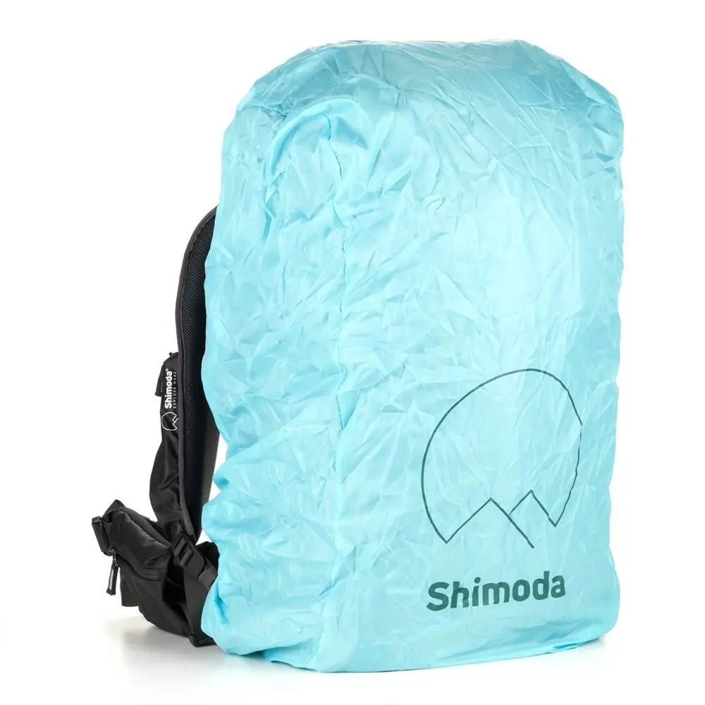 Light blue backpack rain cover with Shimoda logo on a white background