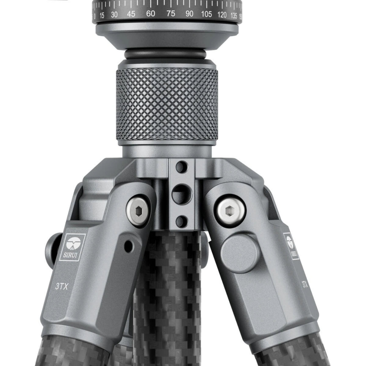 Close-up of a camera tripod with a textured metal center column, silver metal joints, and a carbon fiber leg pattern on a white background.