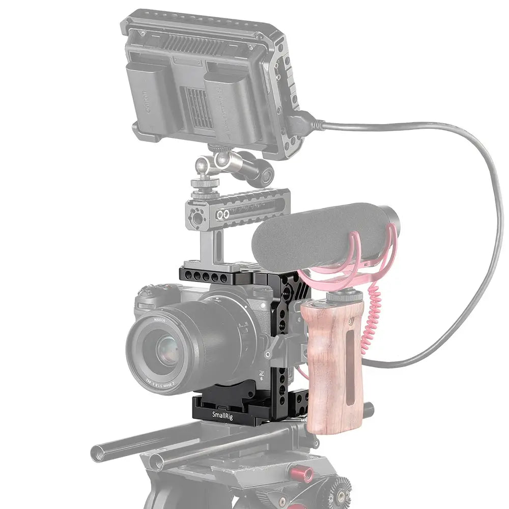 Camera rig with microphone and monitor on a white background