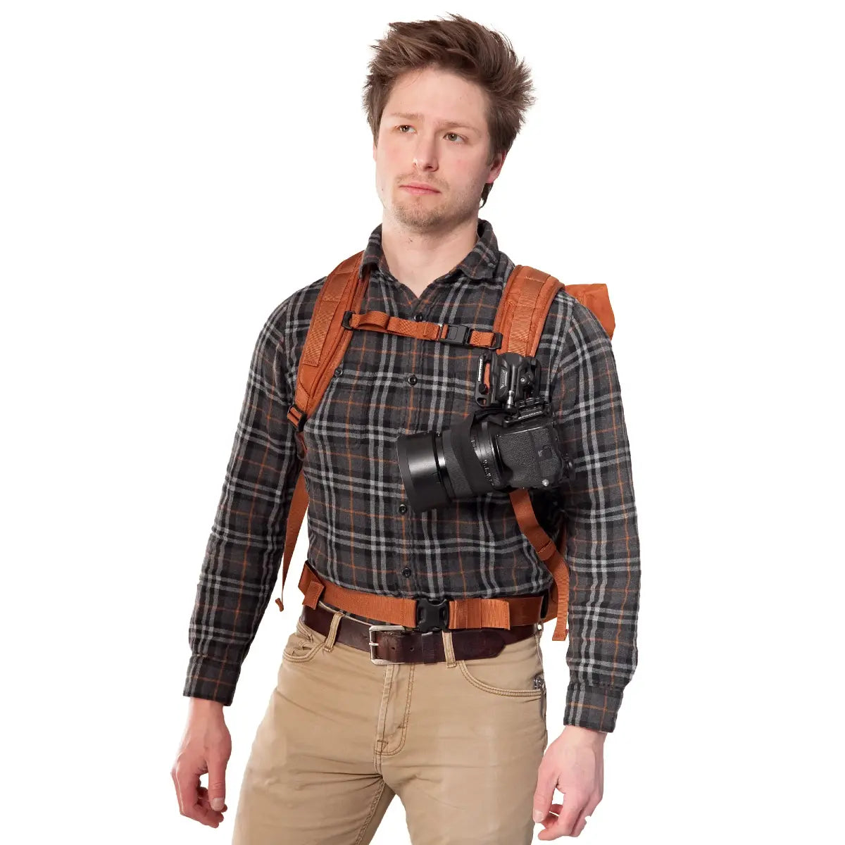Man wearing a camera harness with a camera on a white background