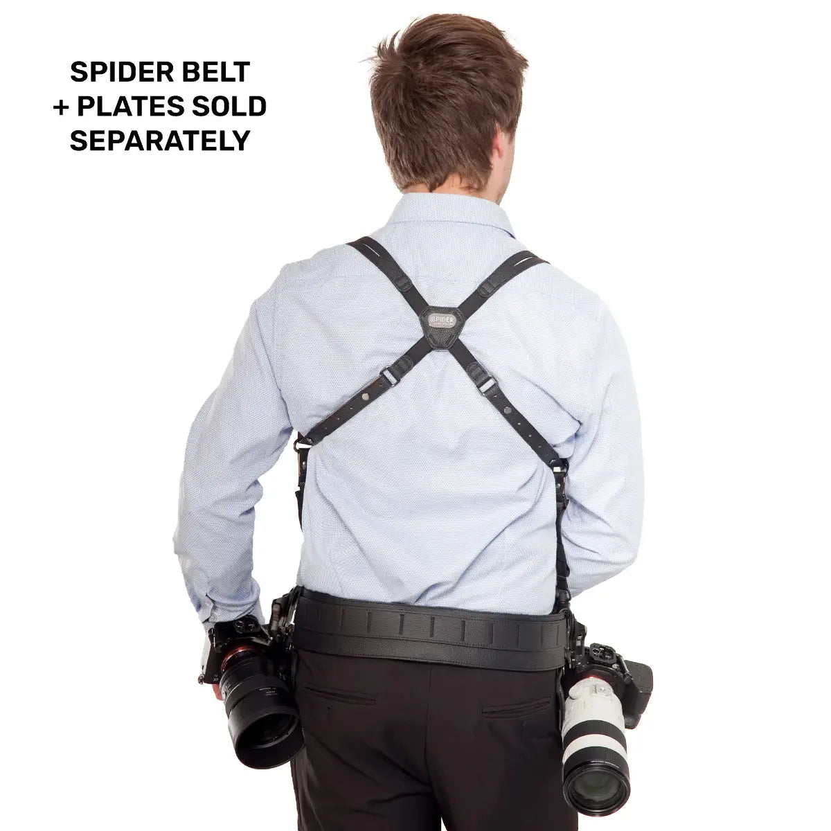 Person wearing a camera harness with two cameras attached, on a white background.