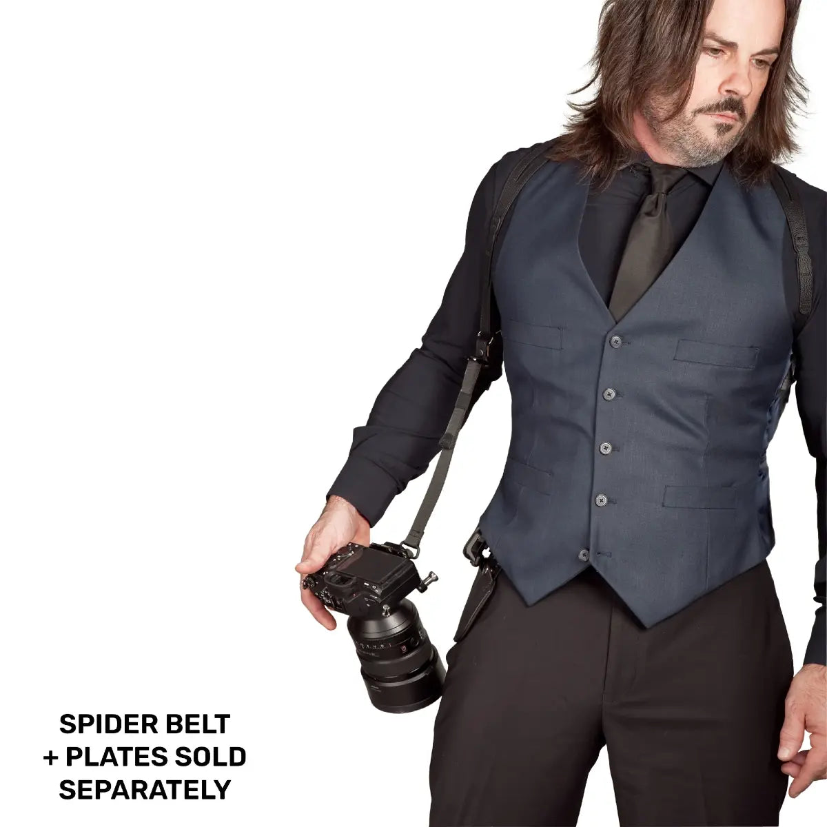 Man wearing a vest with a camera on a white background