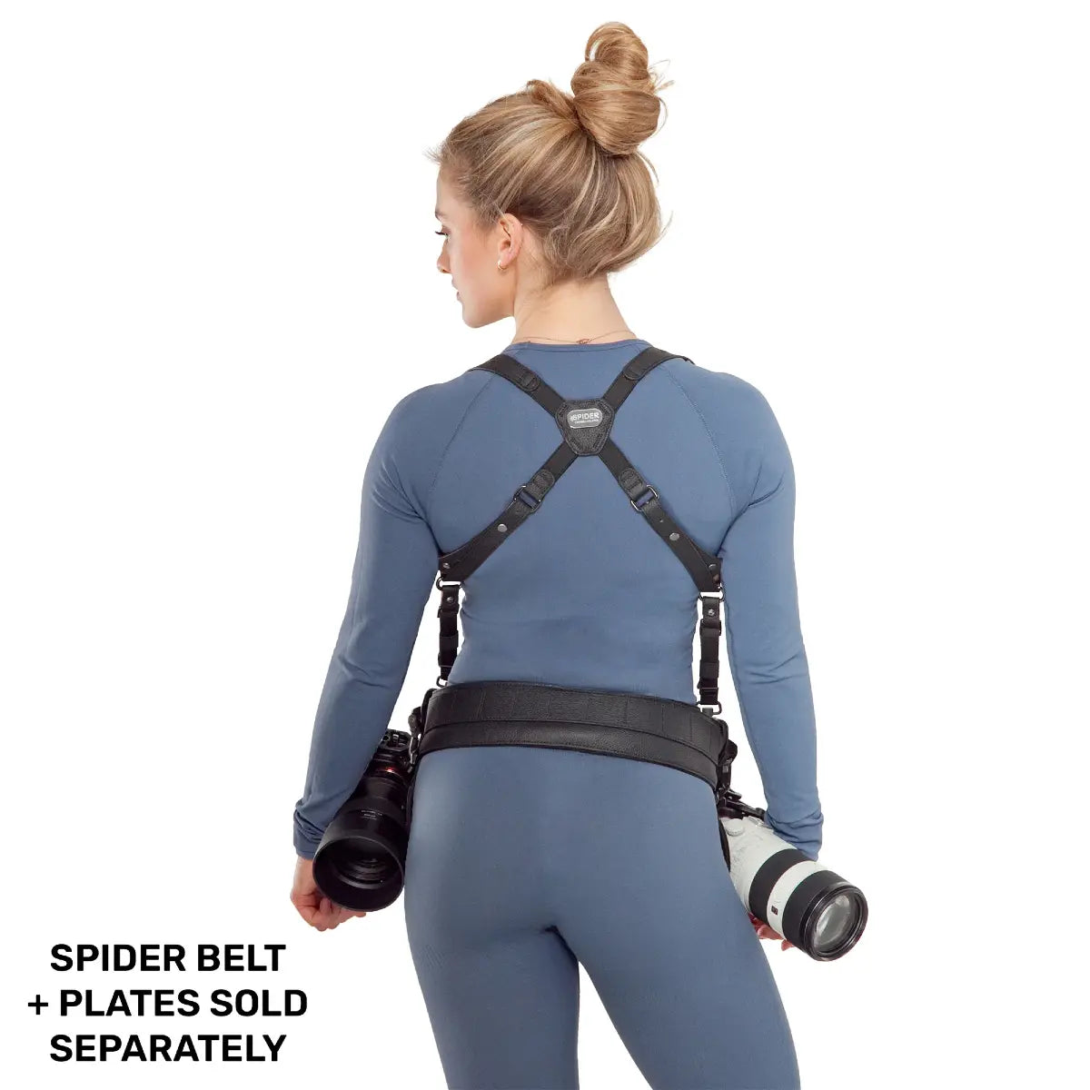 Person wearing a back support system with camera equipment on a white background