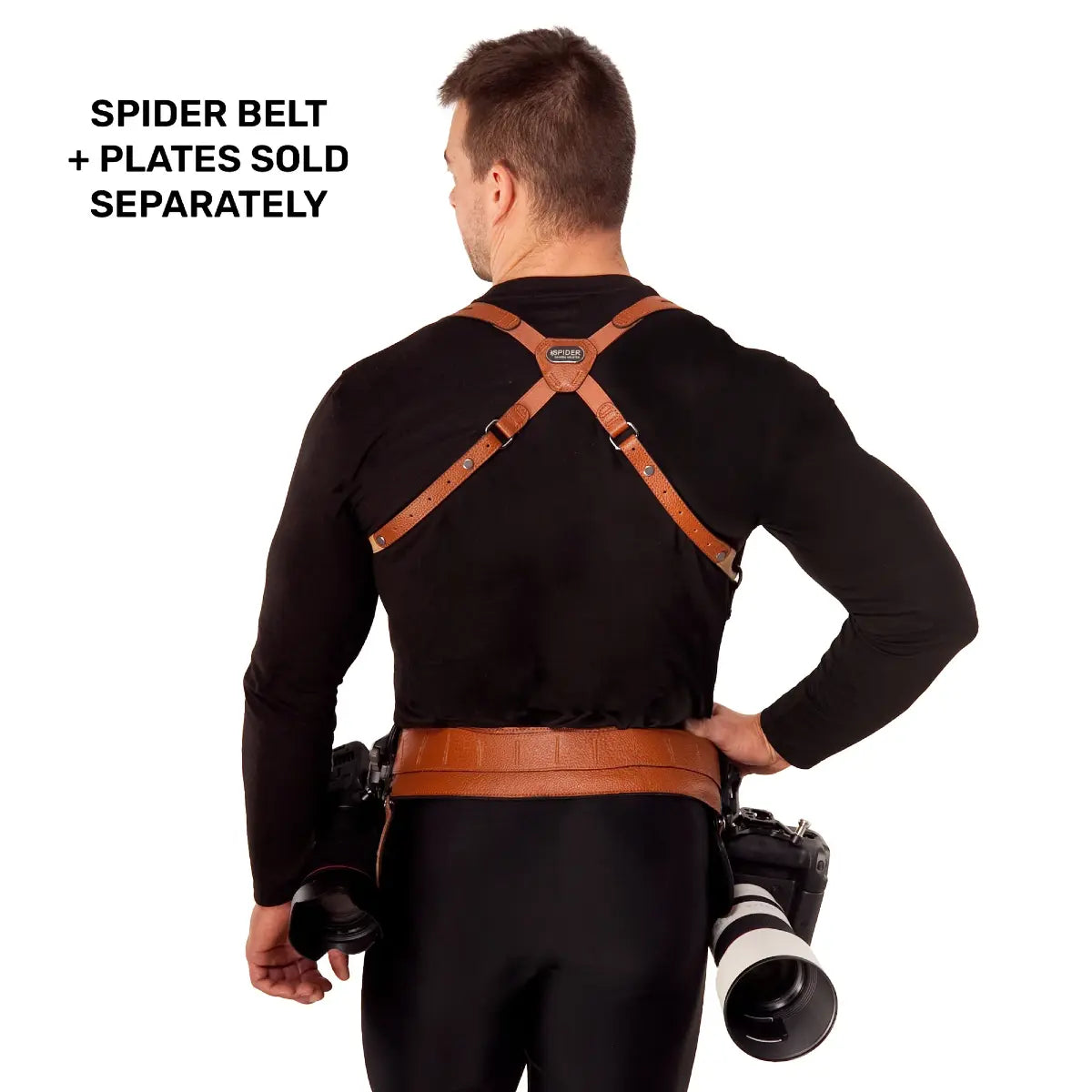 Man wearing a brown leather harness with camera equipment on a white background