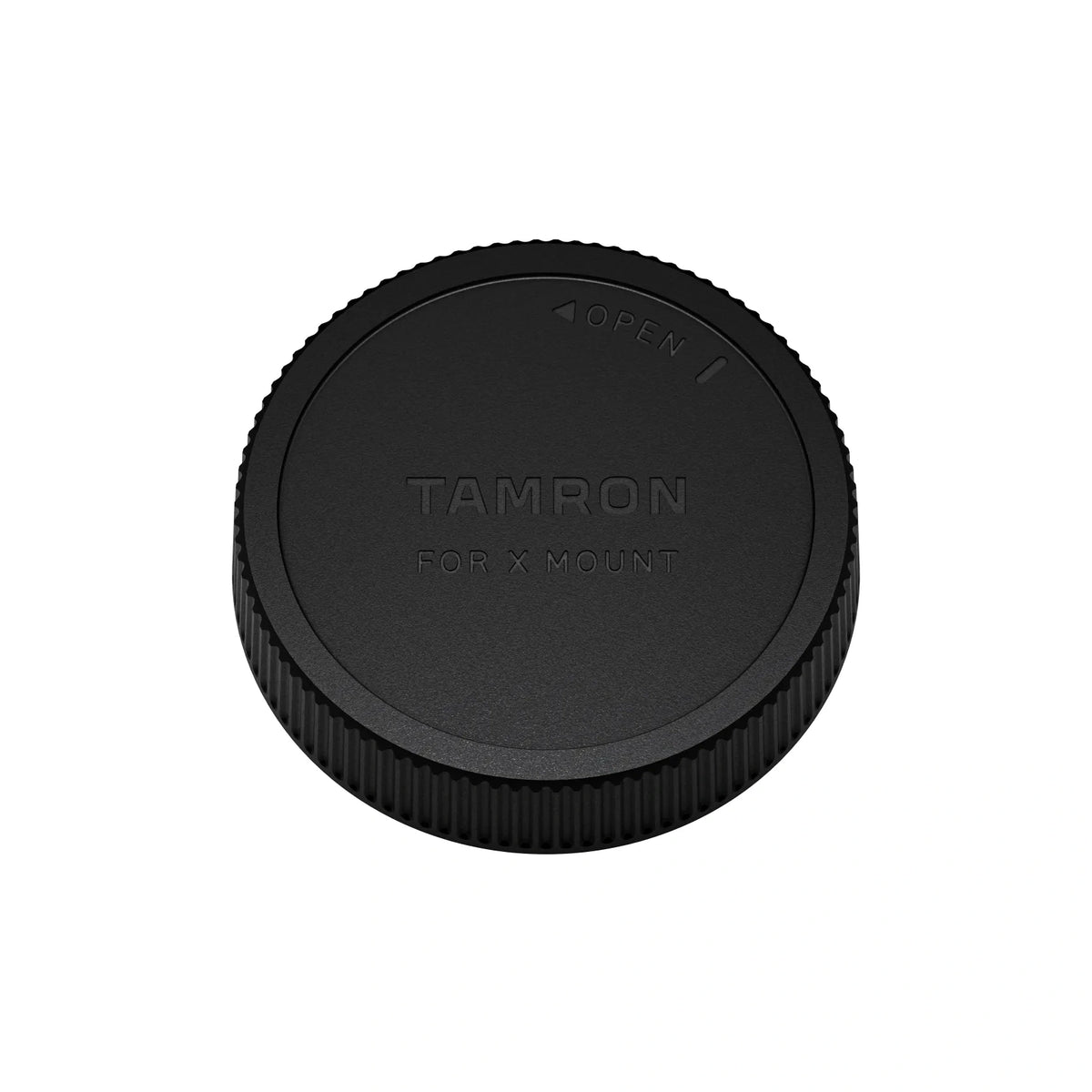 A black Tamron lens cap for X Mount, shown from a top-down perspective on a solid white background.
