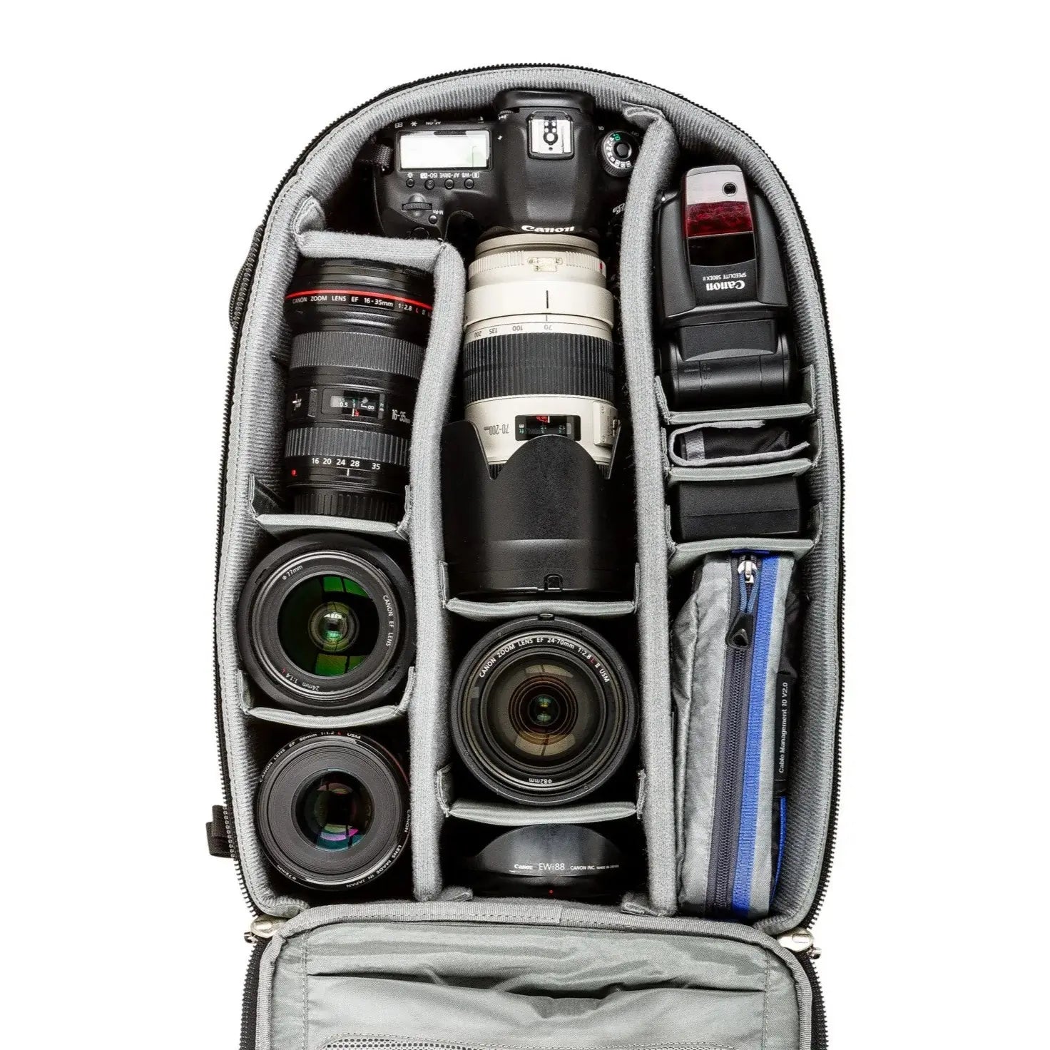 Camera backpack with compartments for camera equipment on a white background