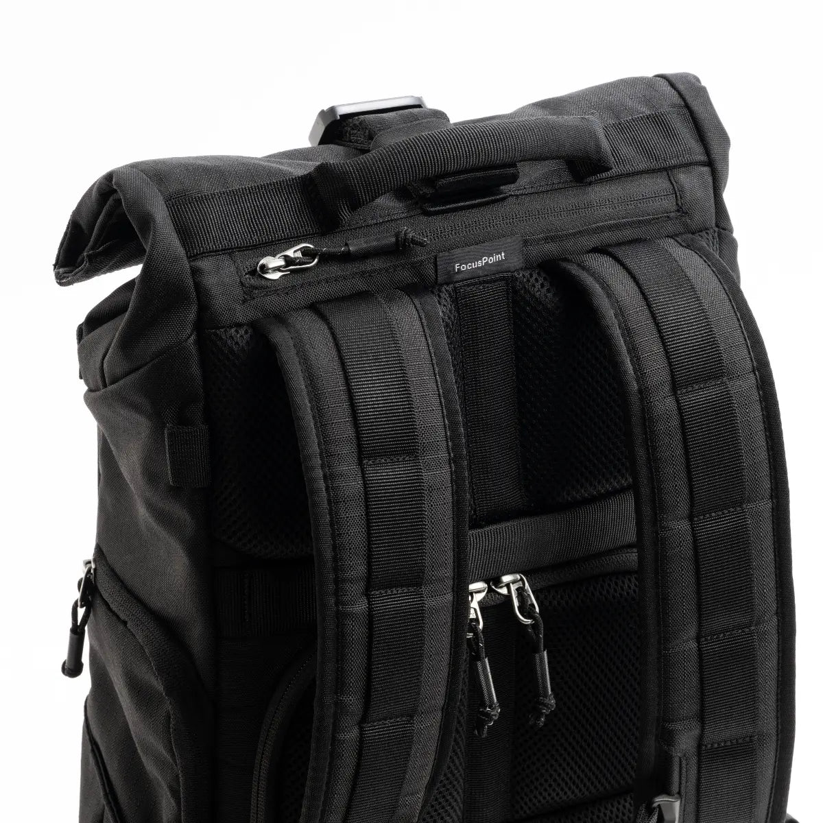 Black backpack with multiple zippers and straps on a white background