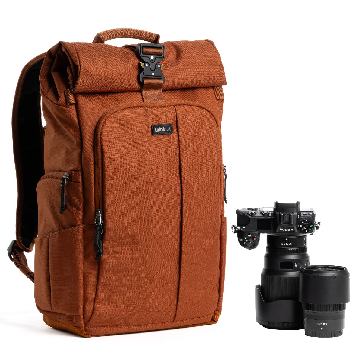 Brown backpack with camera equipment on a white background