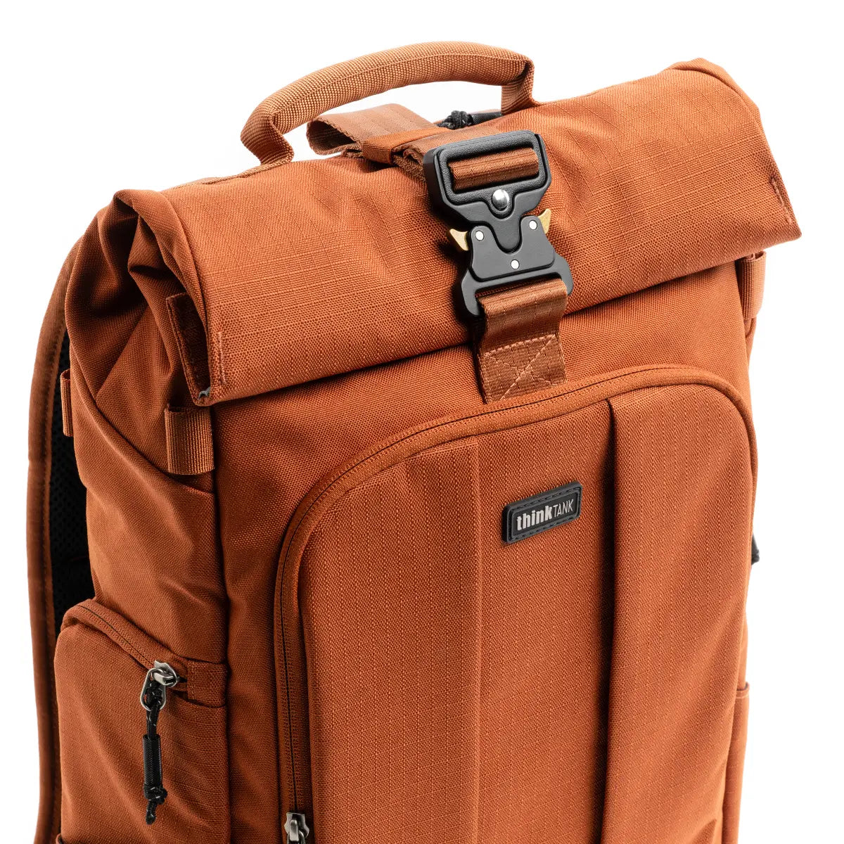 Brown backpack with a prominent buckle on a white background