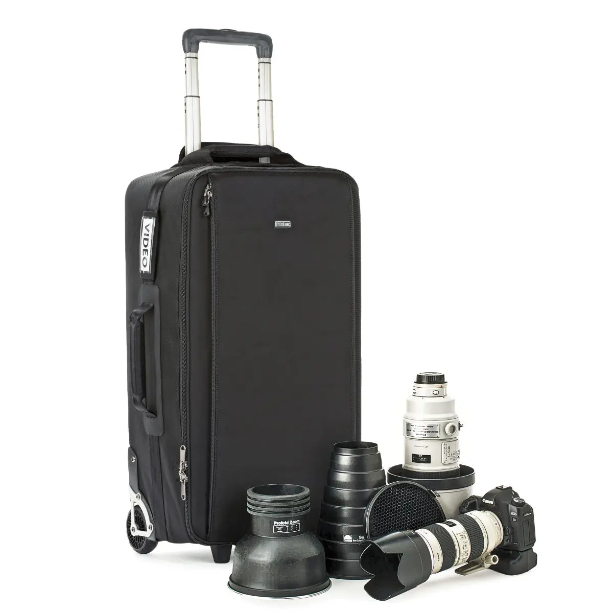 Black suitcase with camera equipment on a white background