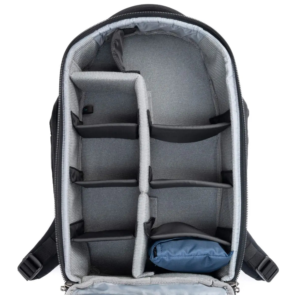 Gray backpack with interior compartments and a blue item inside on a white background