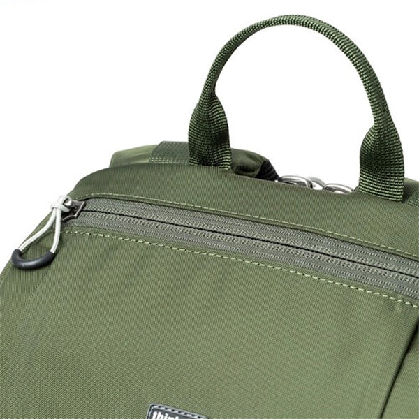 Green backpack with handle and zipper details on a white background