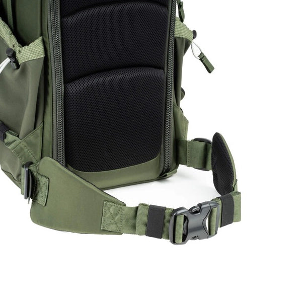 Green backpack with black interior on a white background