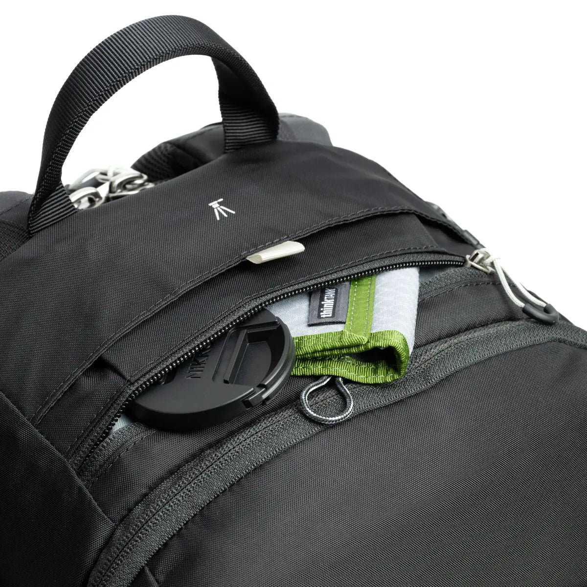Close-up of a black backpack with a visible brand logo on a white background