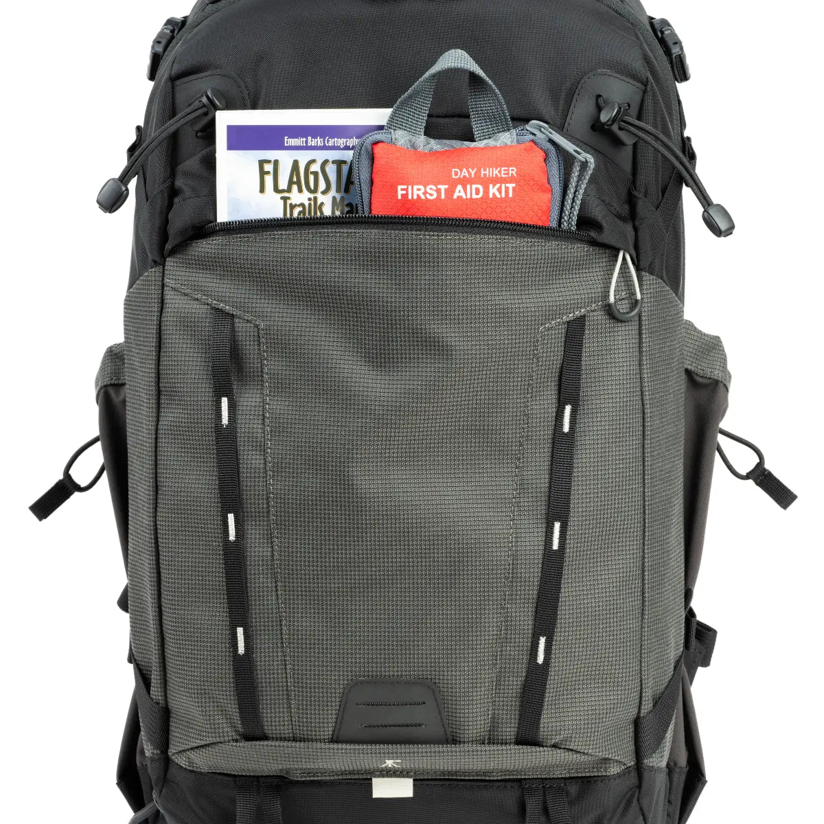 Backpack with labeled compartments including a first aid kit and flag stick case on a white background