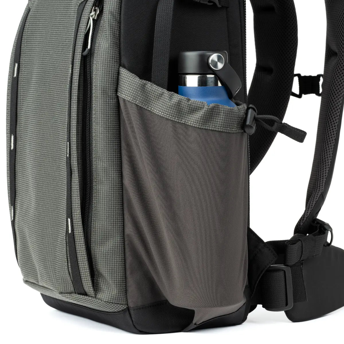 Gray backpack with a water bottle in a side pocket on a white background