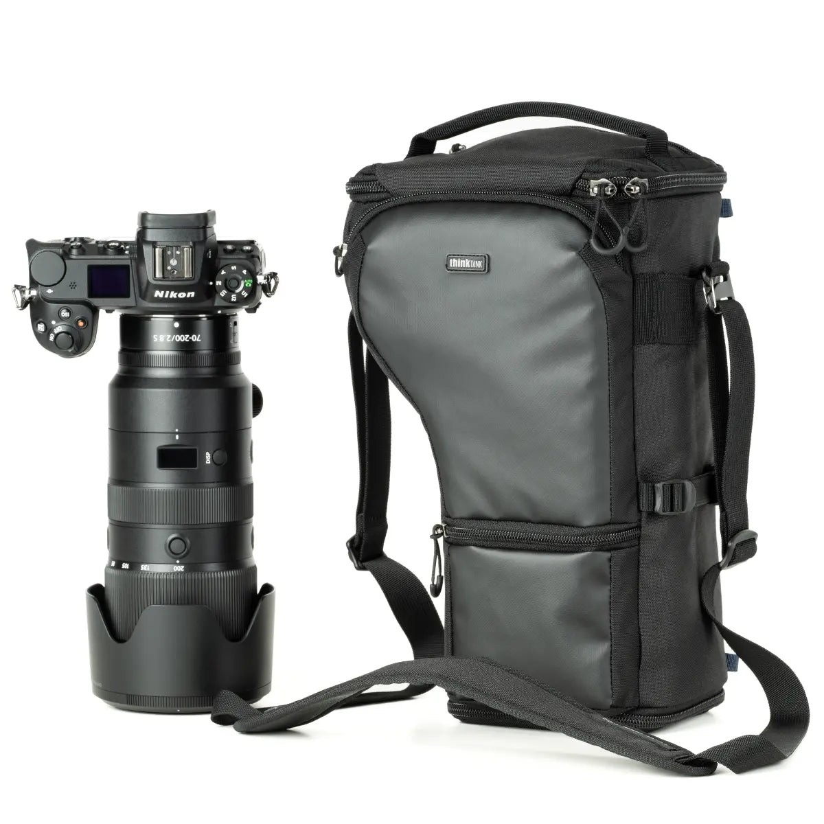 Camera with lens and backpack on a white background