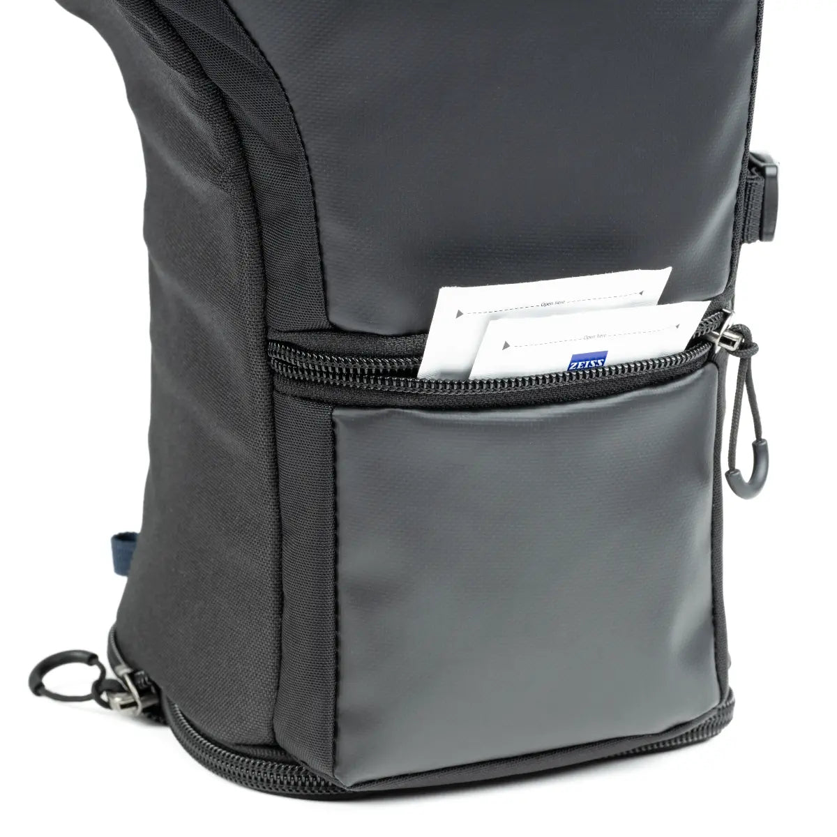 Gray backpack with a front pocket containing papers on a white background