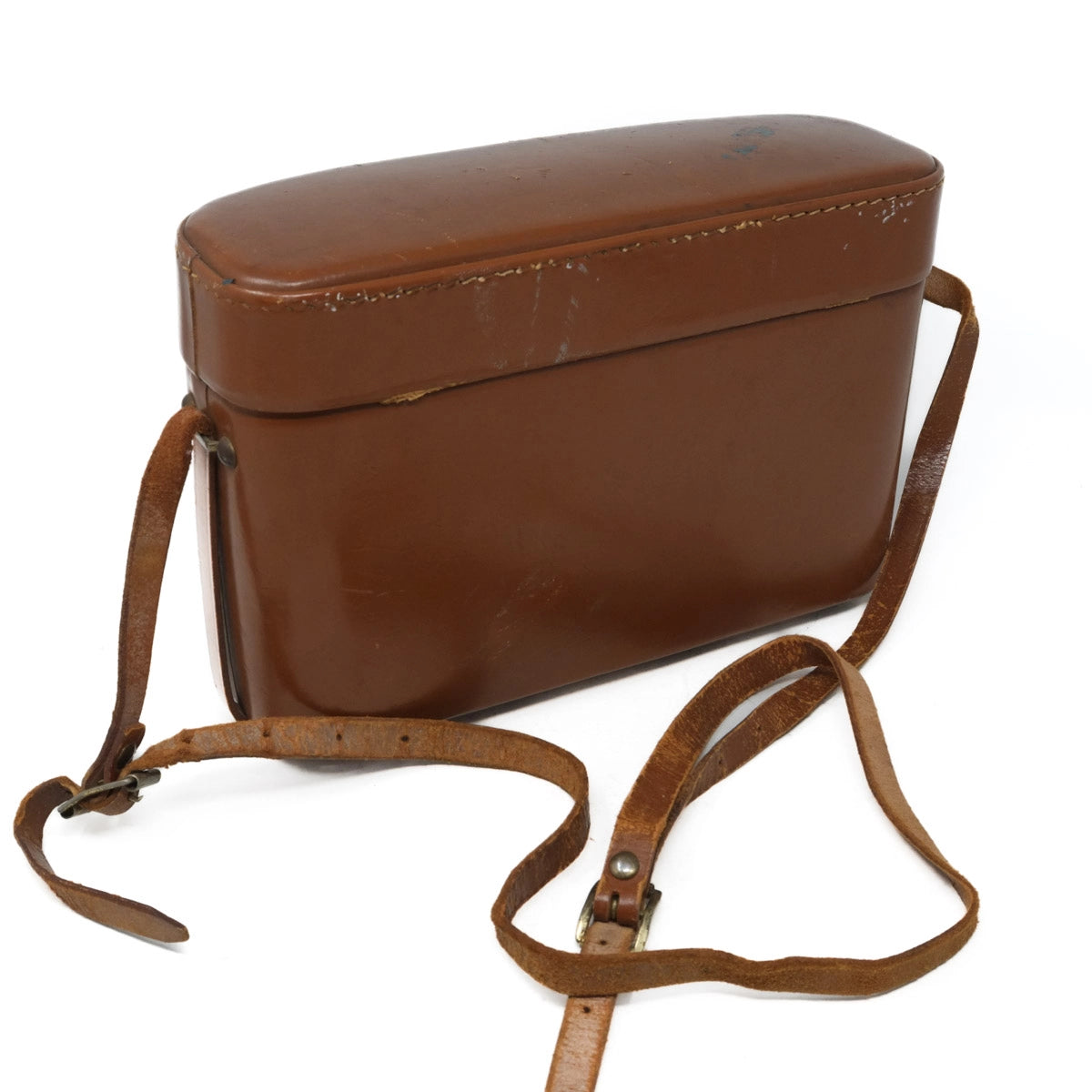 Brown leather bag with a strap on a white background