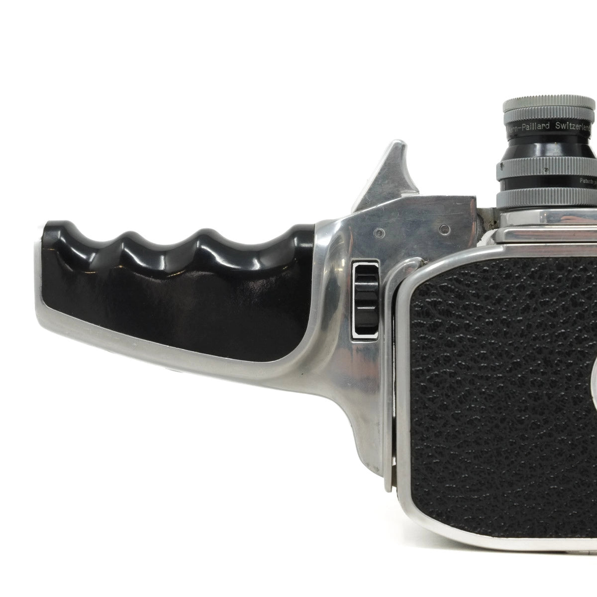 Vintage camera with black leather grip and metallic body on a white background