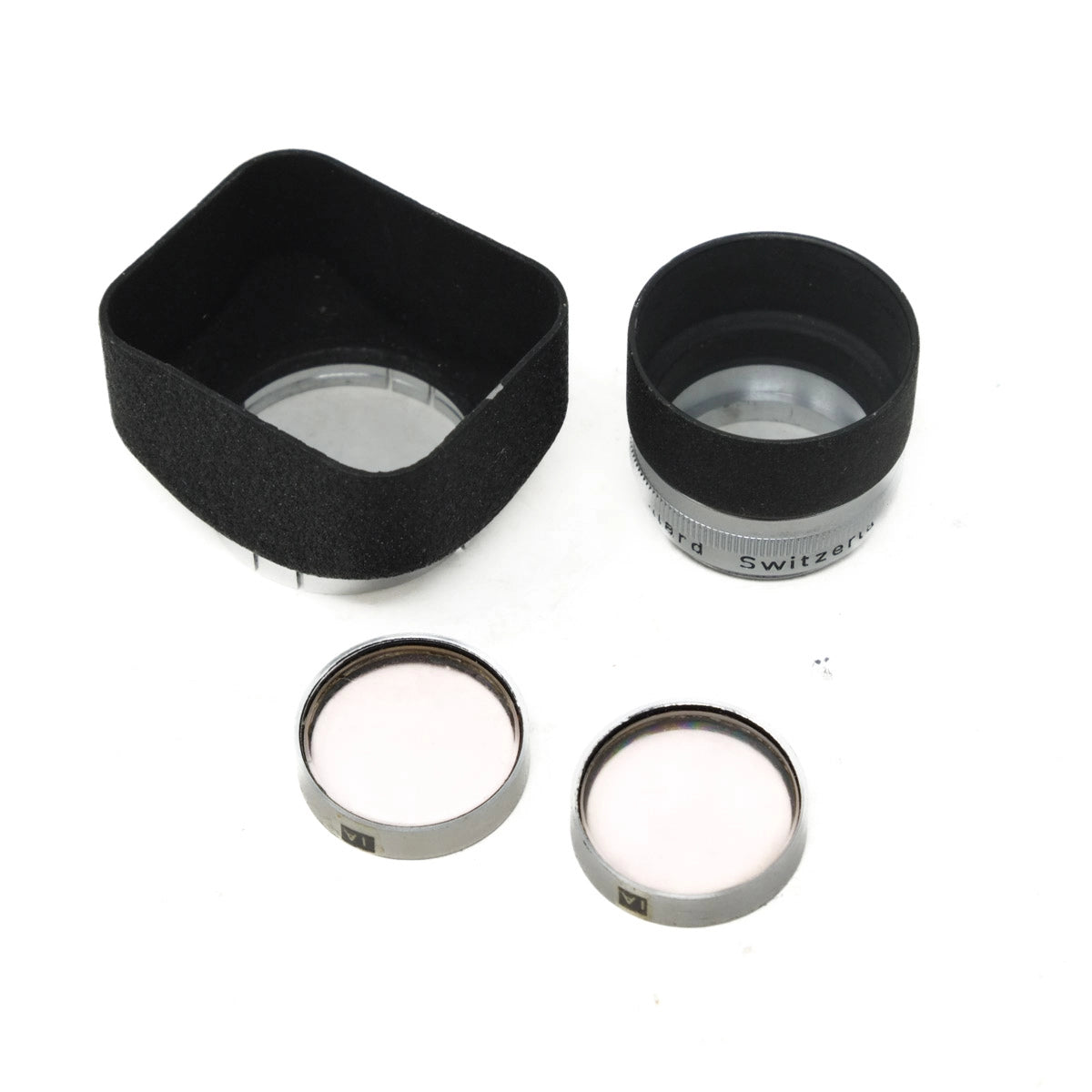 Camera lens hood and filters on a white background