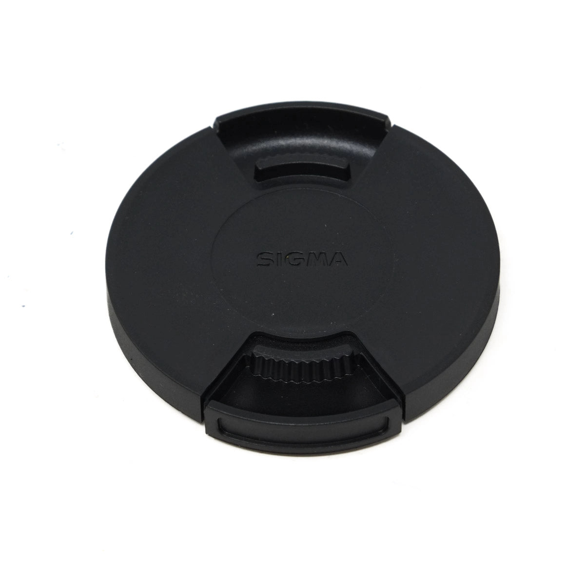 Black camera lens cap with Sigma branding on a white background