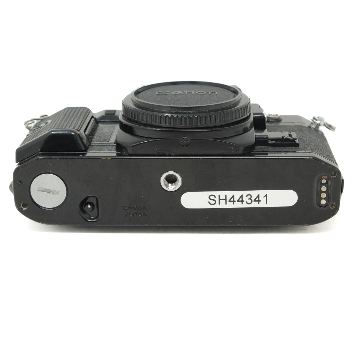 Black camera body with visible model number on a white background