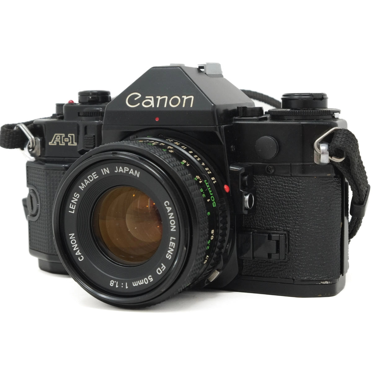 Used Canon A-1 Classic film camera with 50mm f1.8 and instructions - front angle 