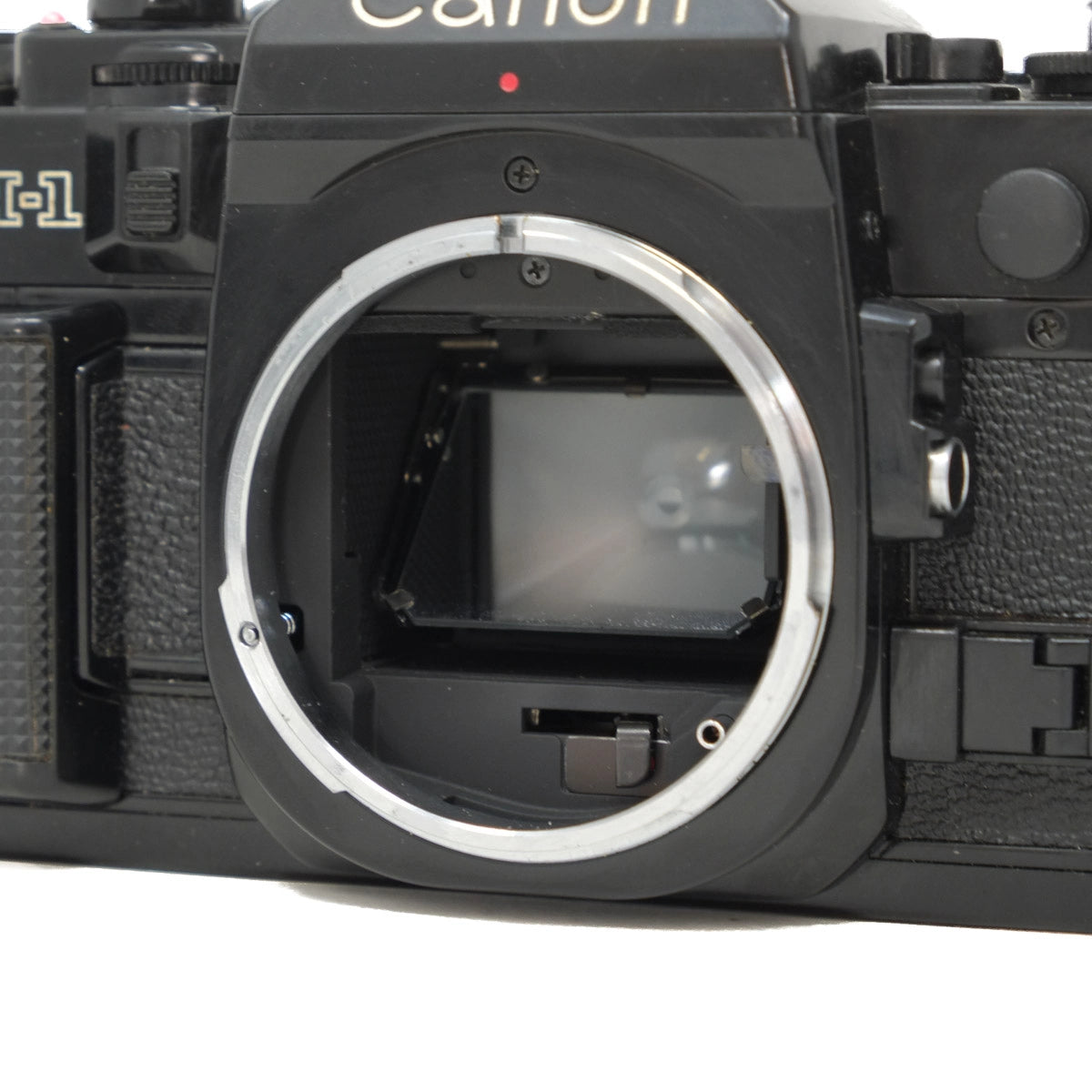 Used Canon A-1 Classic film camera with 50mm f1.8 and instructions - front angle 