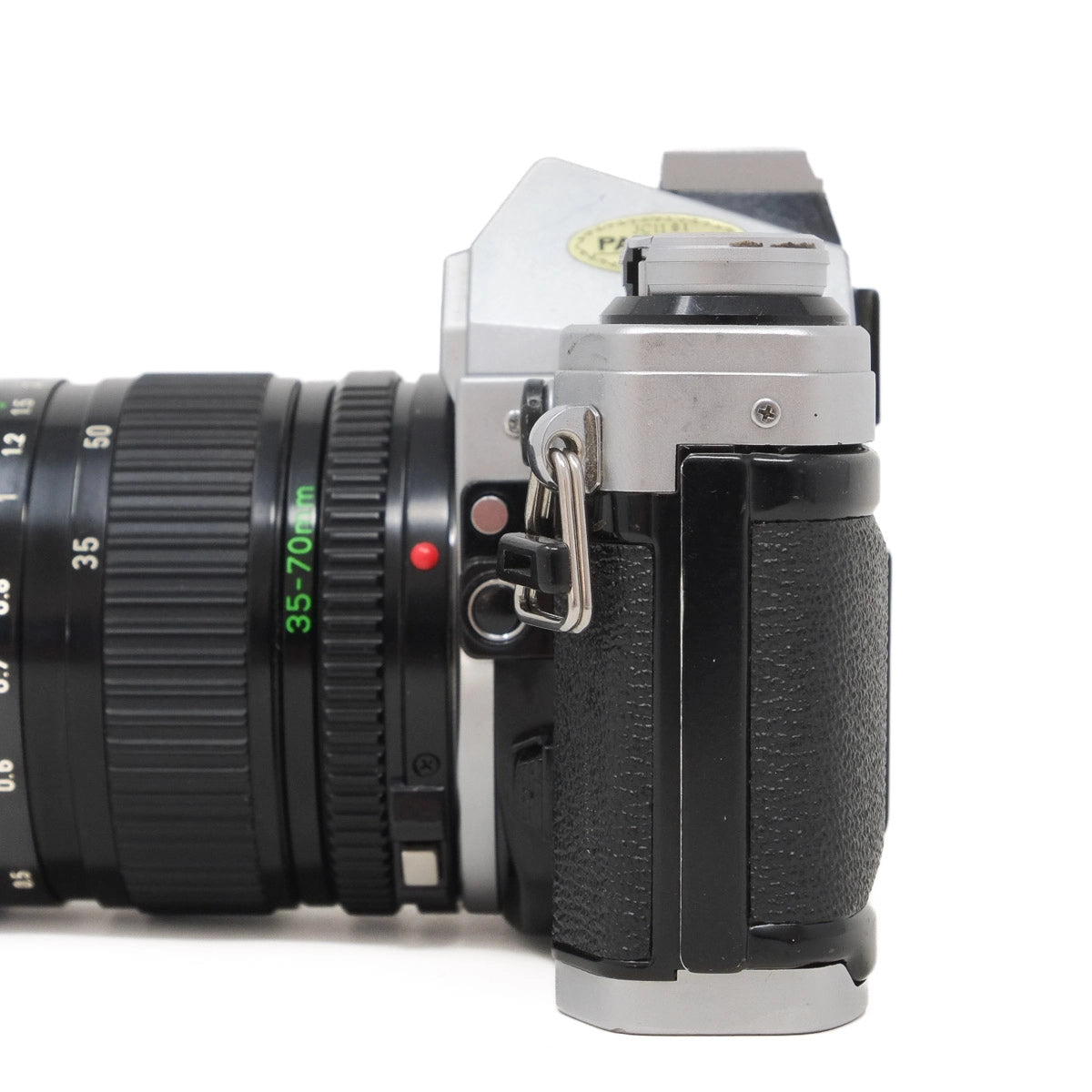 Used Canon AE-1 Film camera with Canon 35-70mm Zoom lens - side angle 
