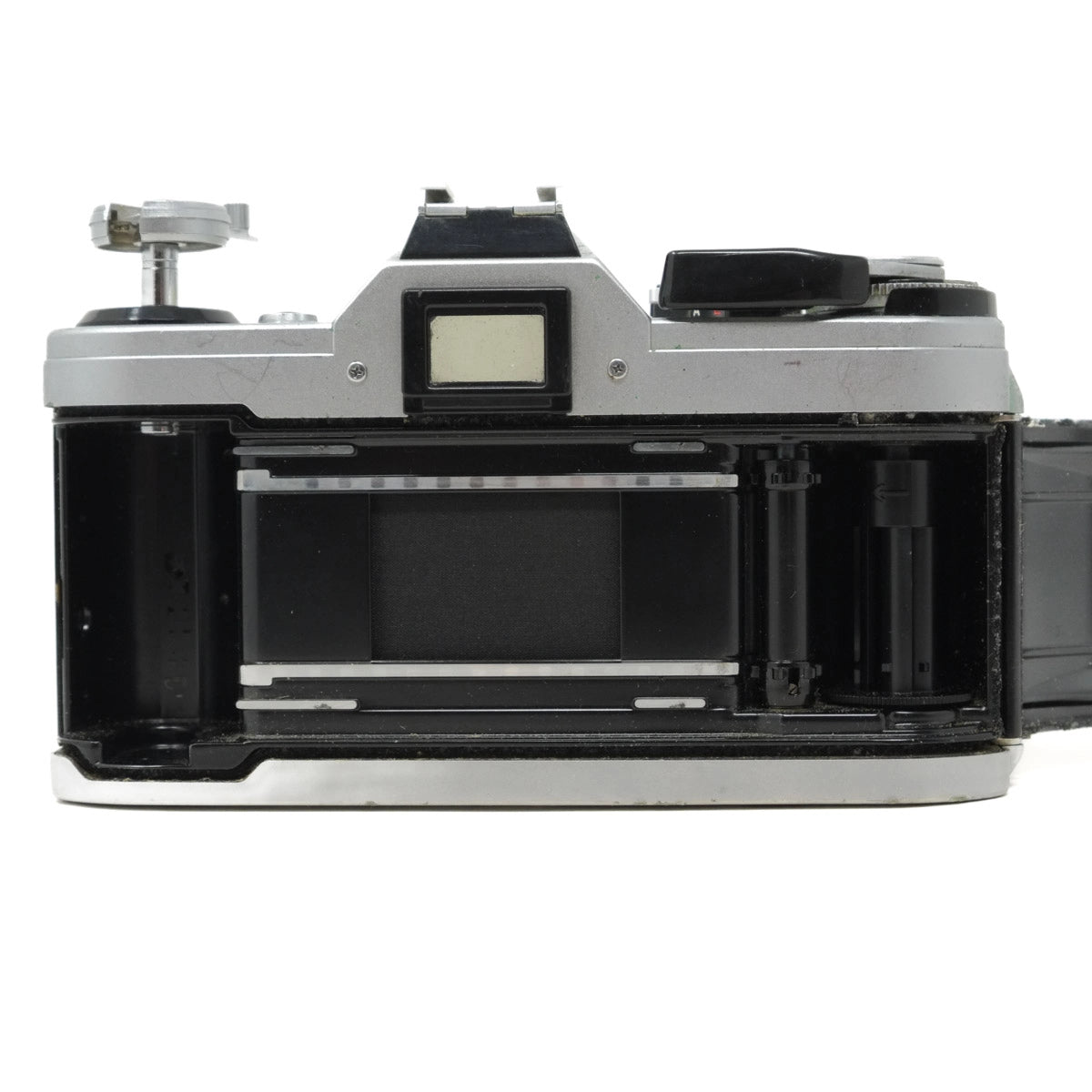 Vintage camera with open film chamber on a white background