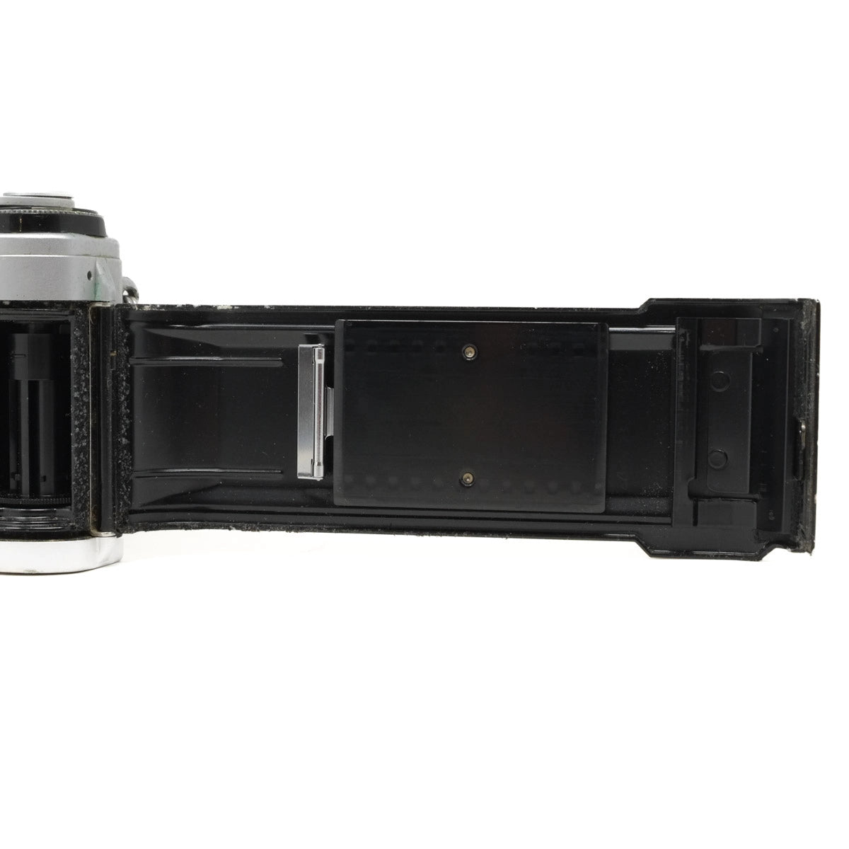 Camera body with open film compartment on a white background