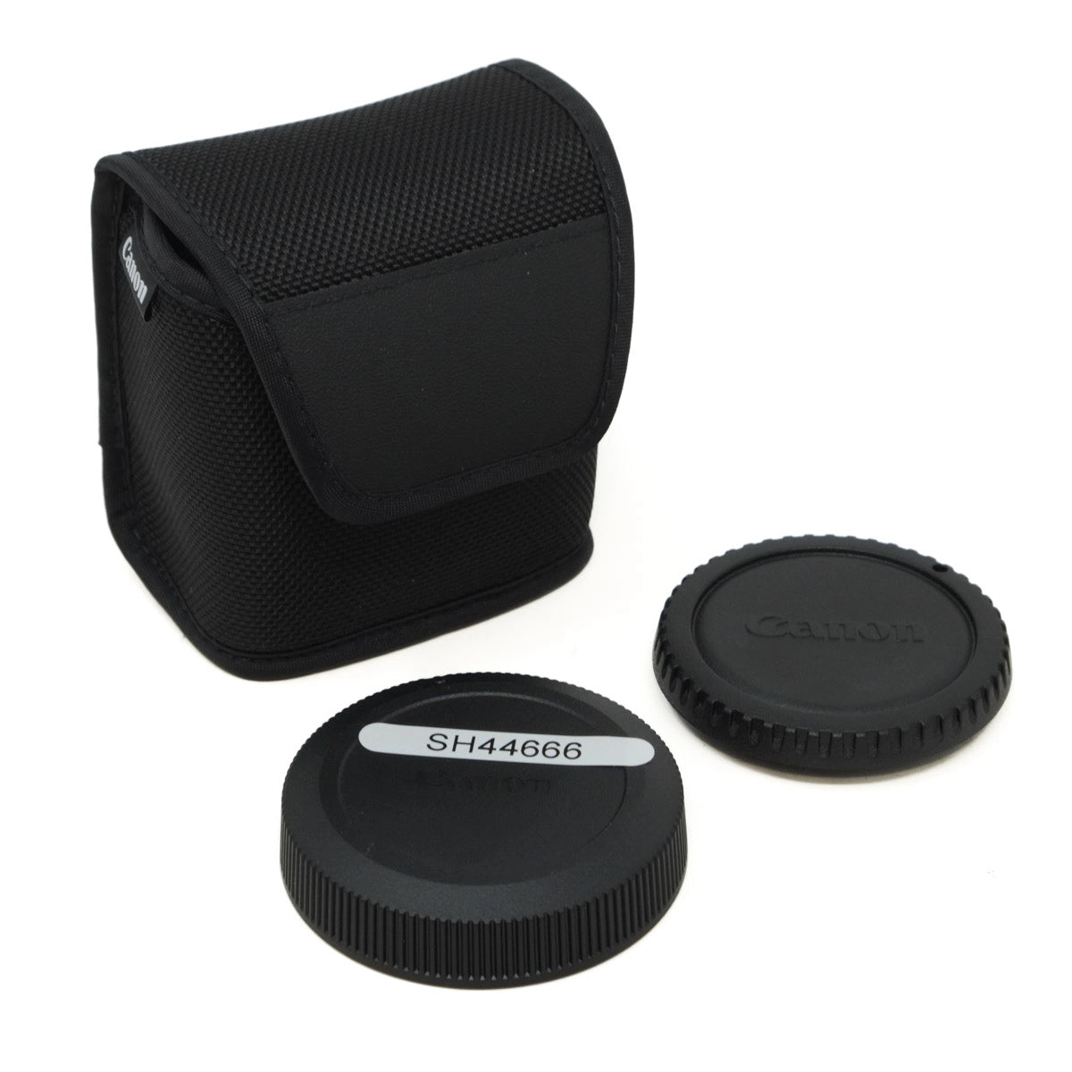 Black camera lens caps and case on a white background