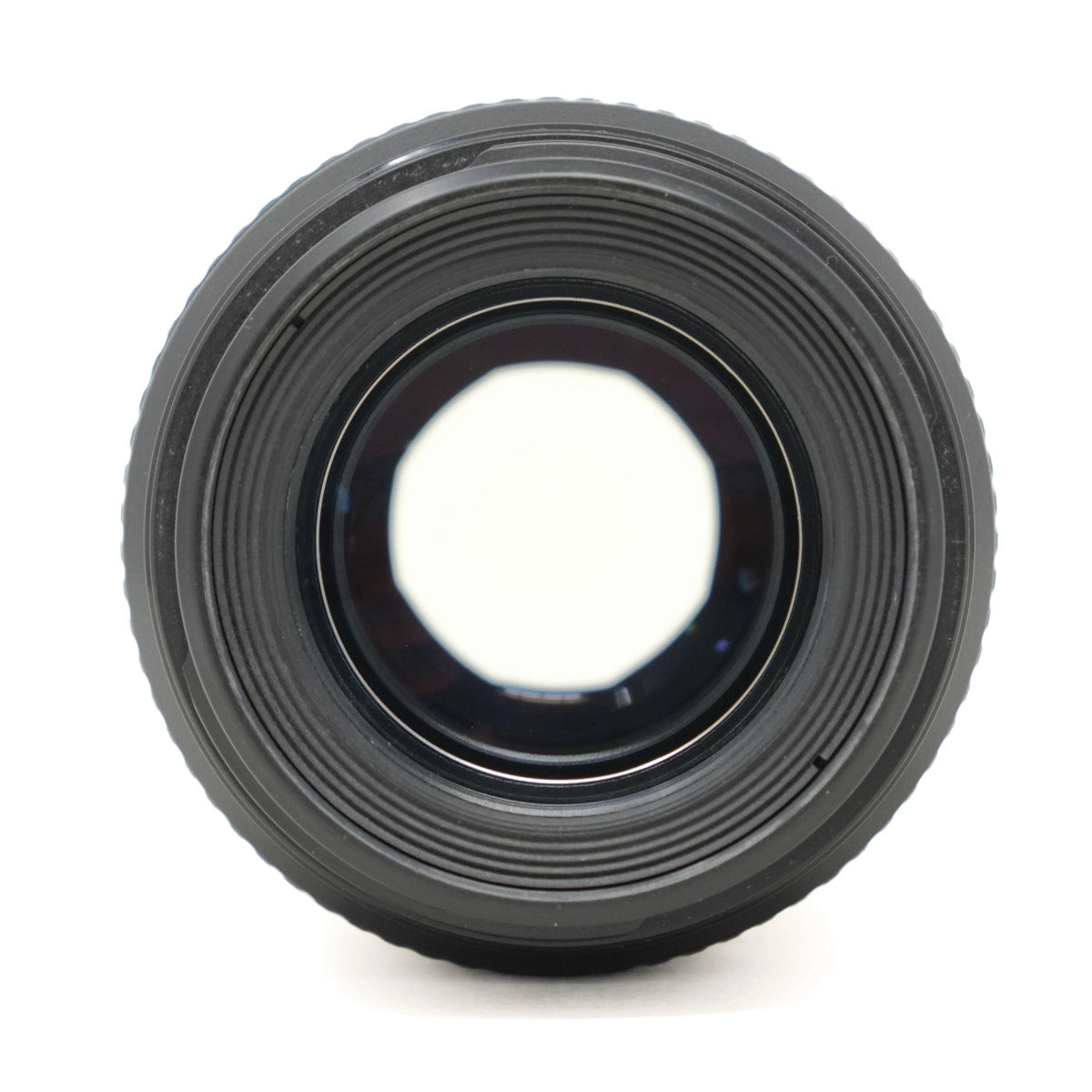 Black camera lens on a white background