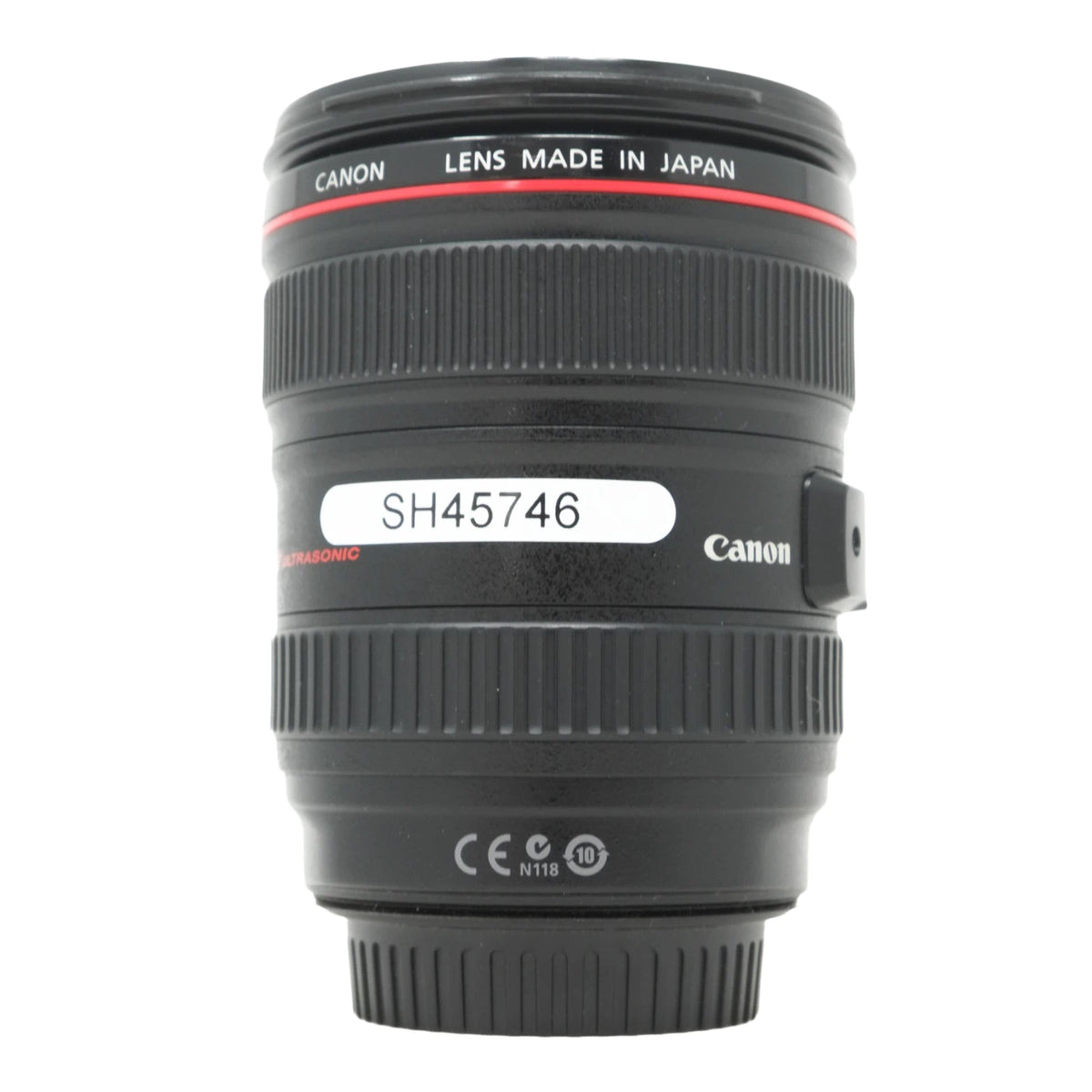 Canon lens made in Japan, black with a red ring and white text, featuring a white label with the number SH45746.