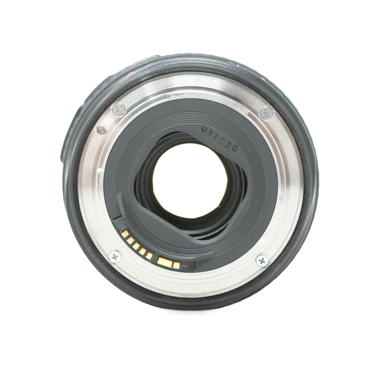 A close-up shot of a camera lens rear mount, showing the metallic silver and black elements, contact points, on a white background.