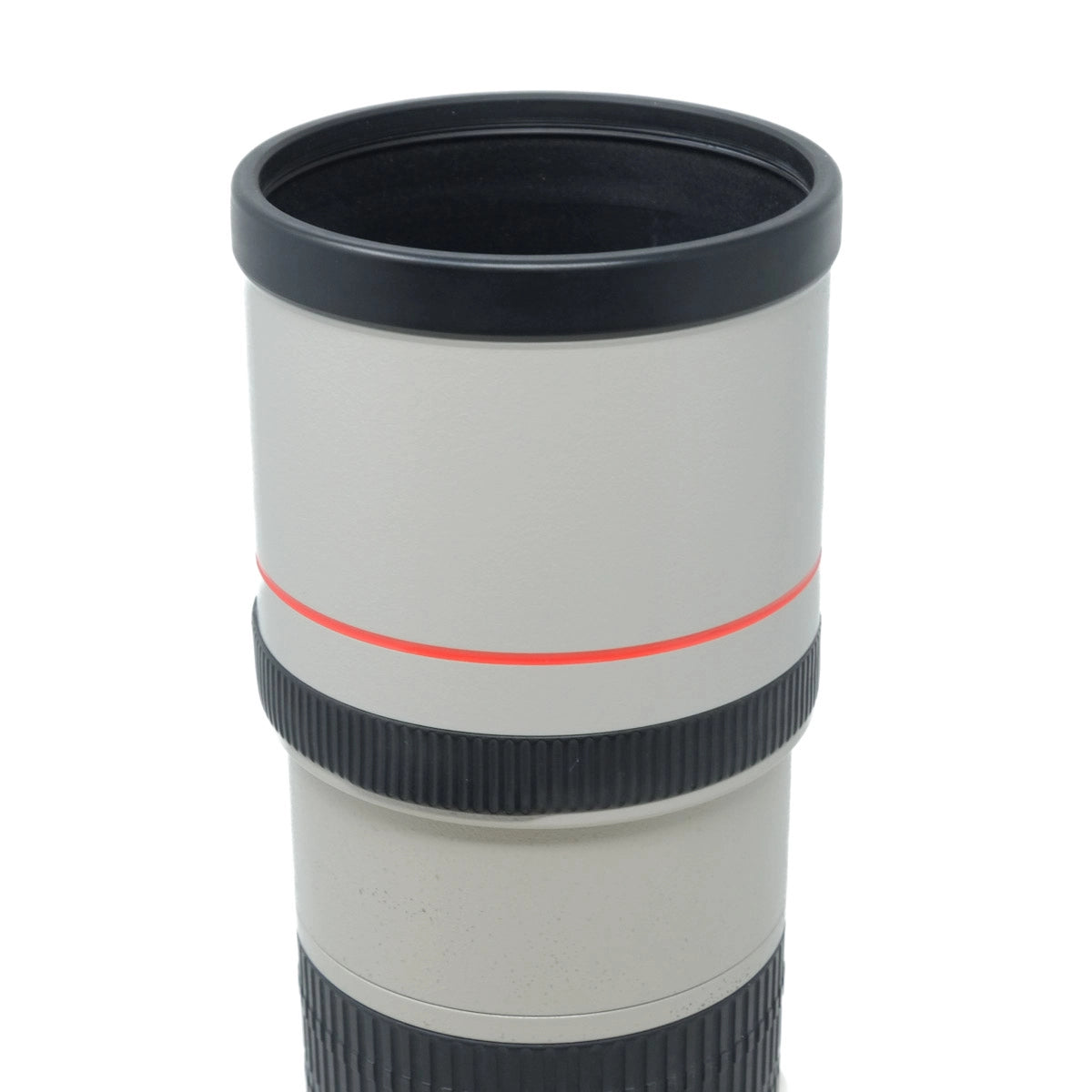 Camera lens with black and red accents on a white background