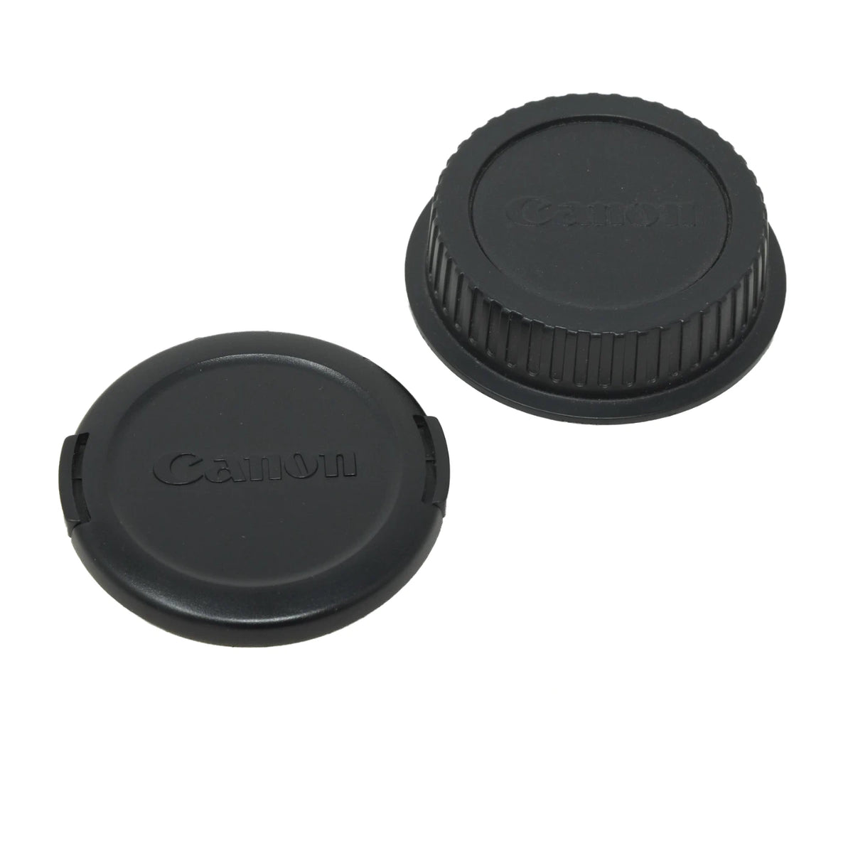 Two black Canon camera lens caps on a plain white background.