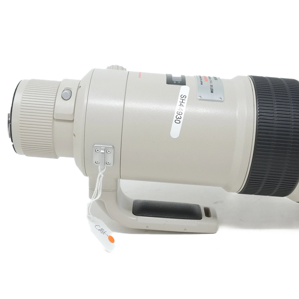 Camera lens with visible branding on a white background