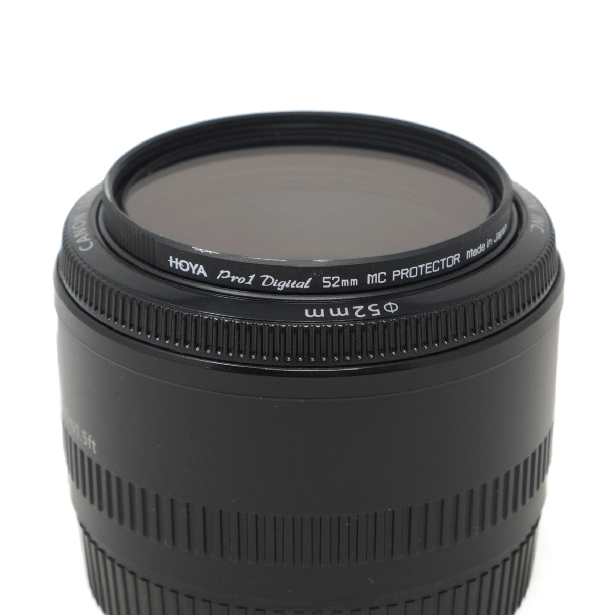 Camera lens with Hoya Pro1 Digital MC Protector on a white background