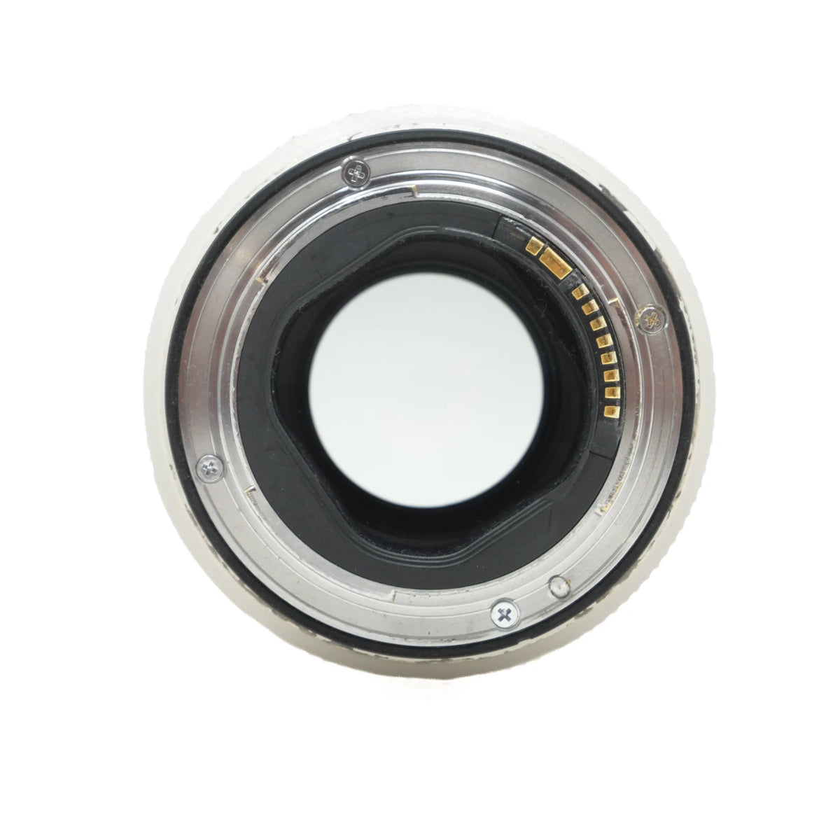A close-up, top-down view of a camera lens mount ring, showing the metal contacts and internal structure against a white background.
