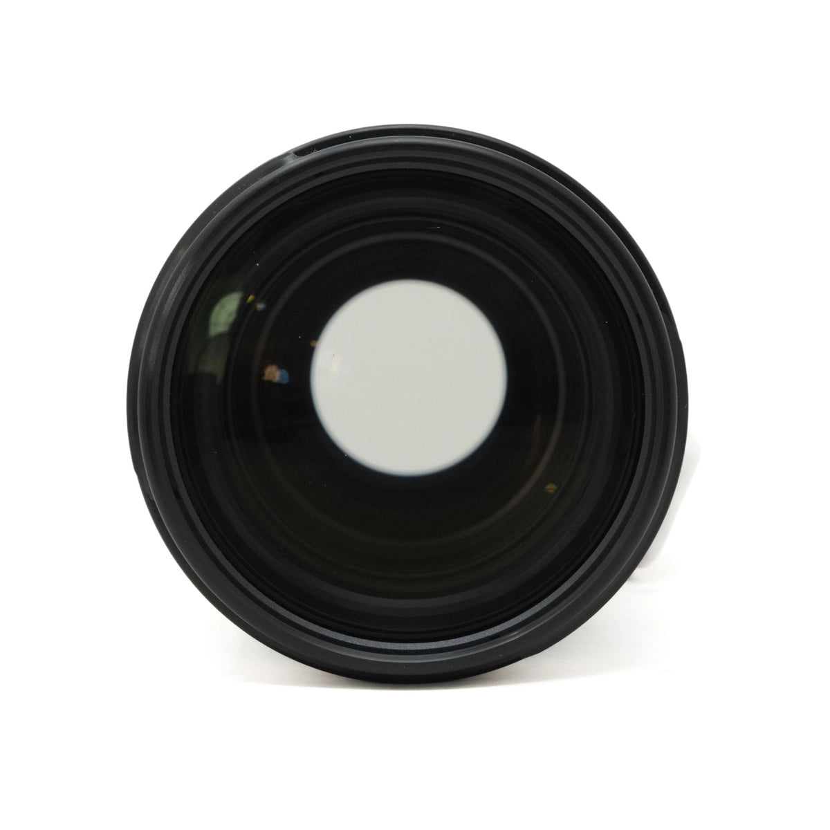 Black camera lens on a white background