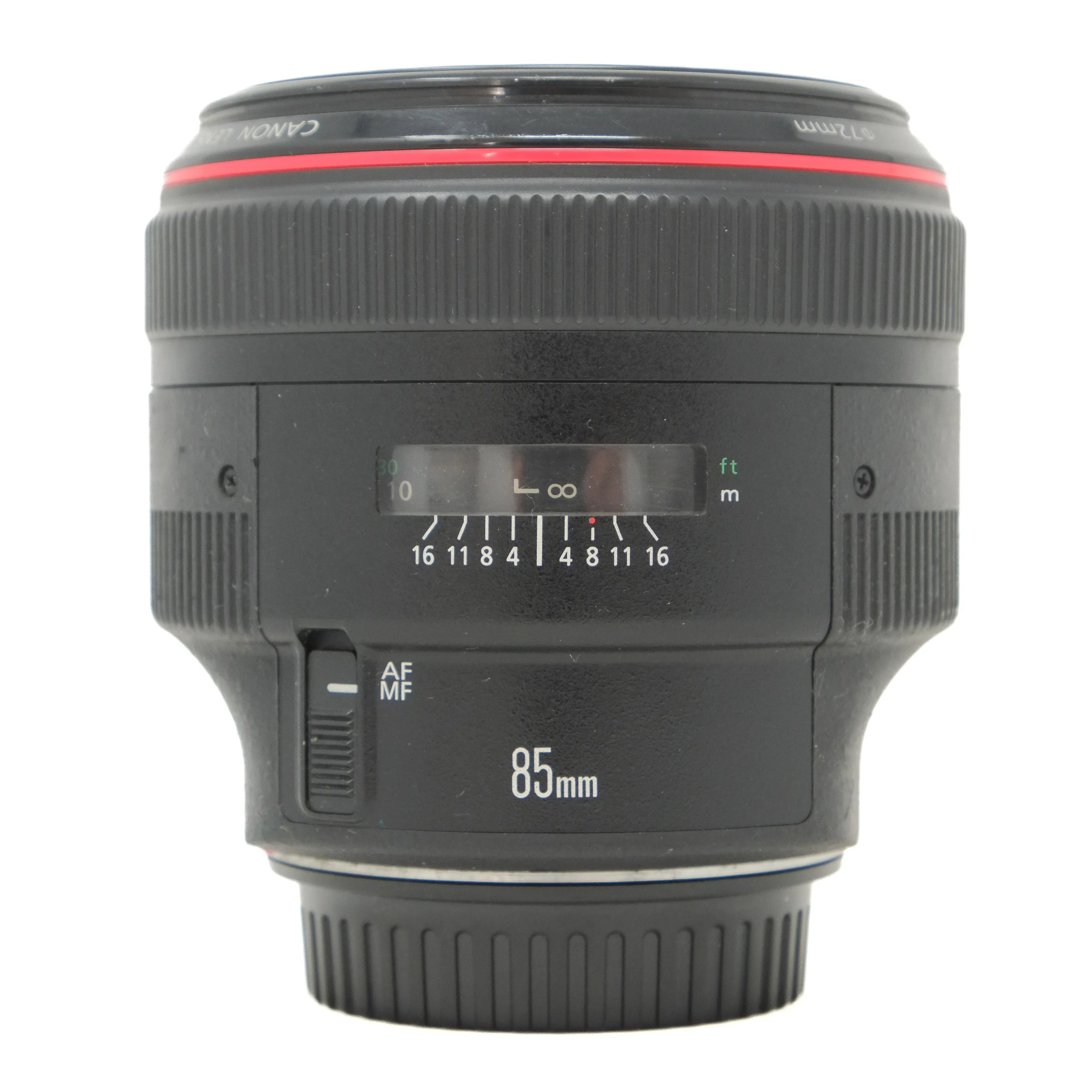 Canon camera lens with focus scale and brand logo on a white background