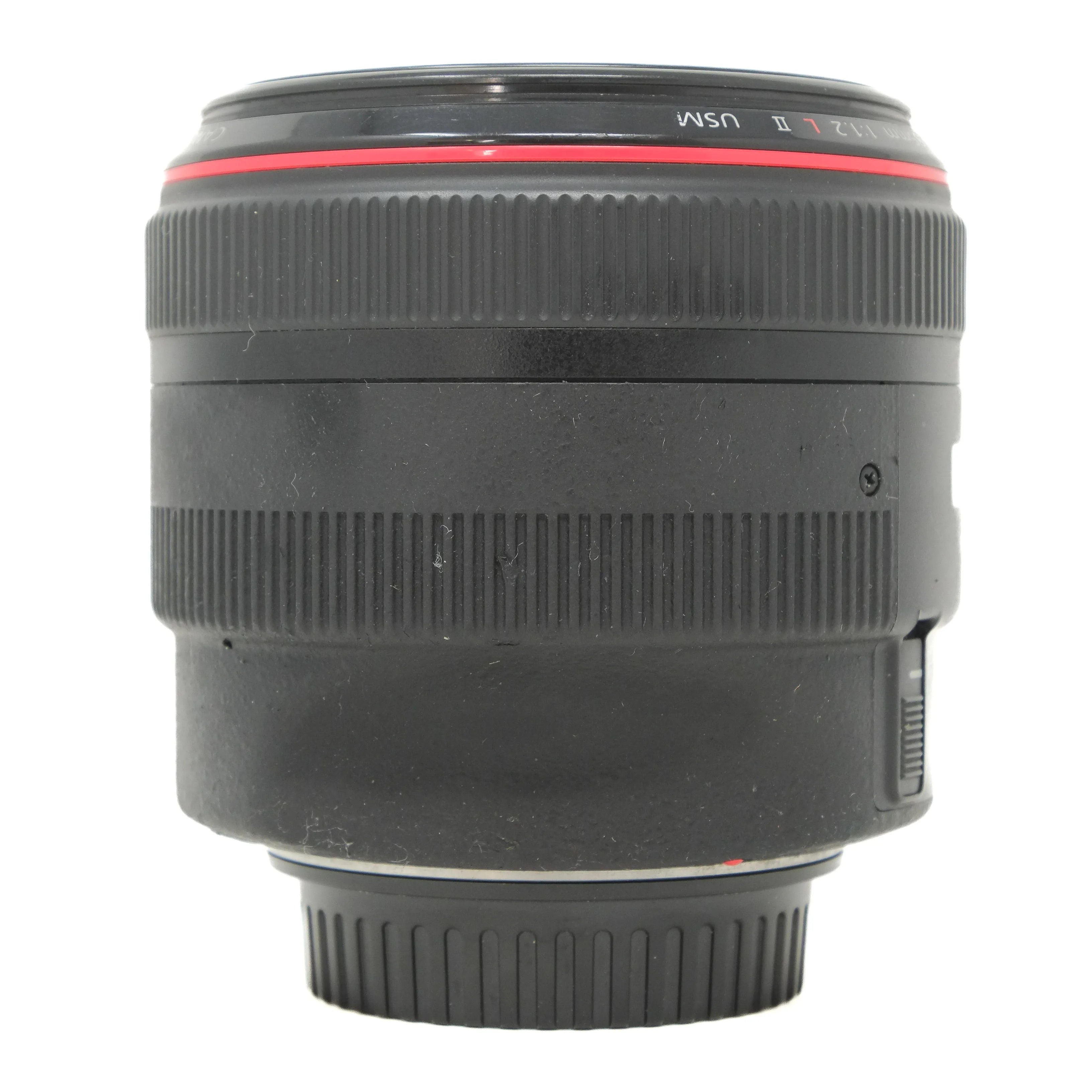 Camera lens with visible brand markings on a white background