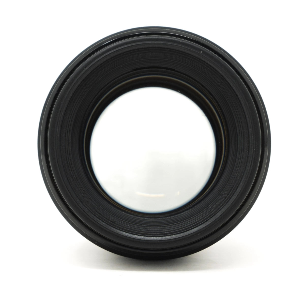Black camera lens on a white background