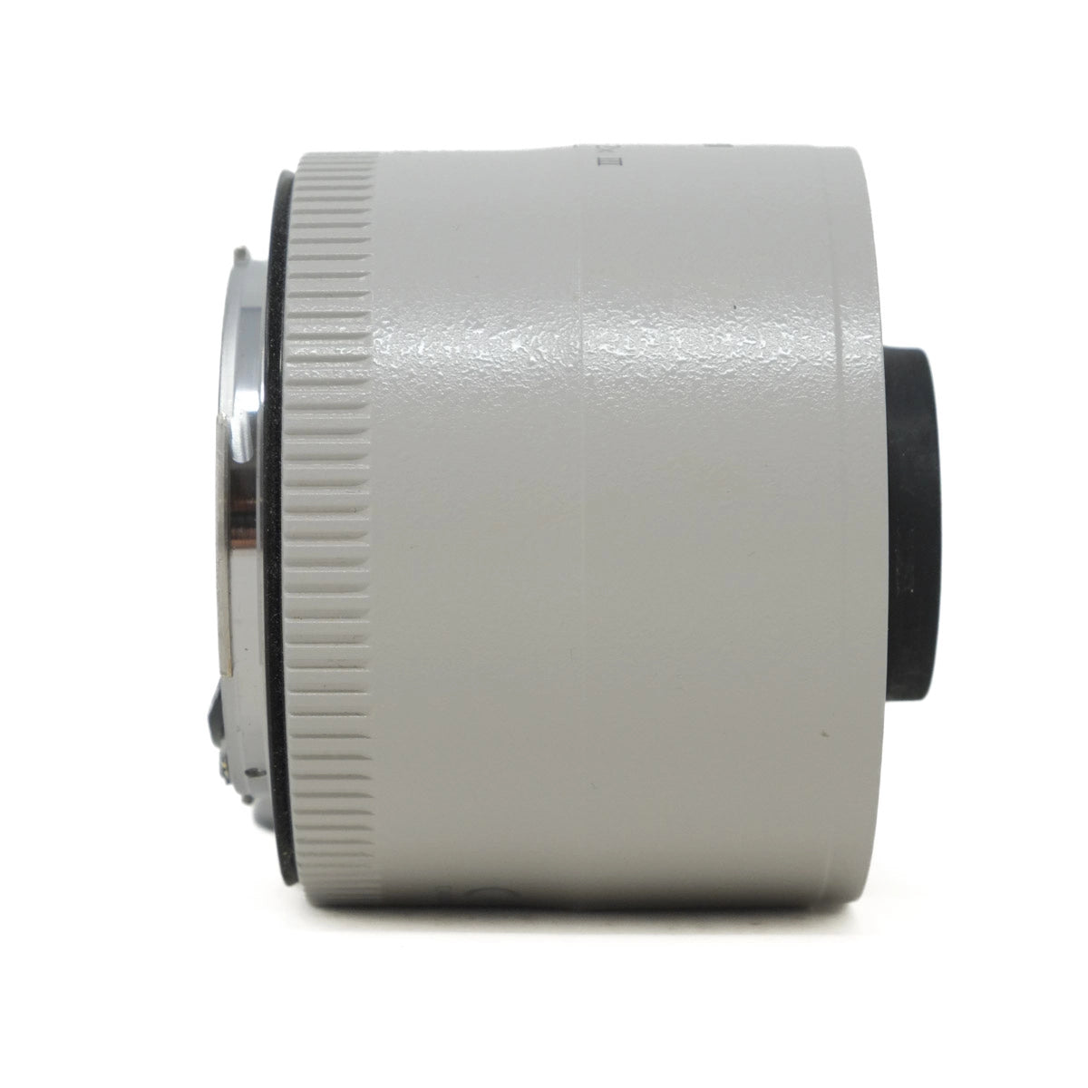Close-up of a camera lens extender on a white background