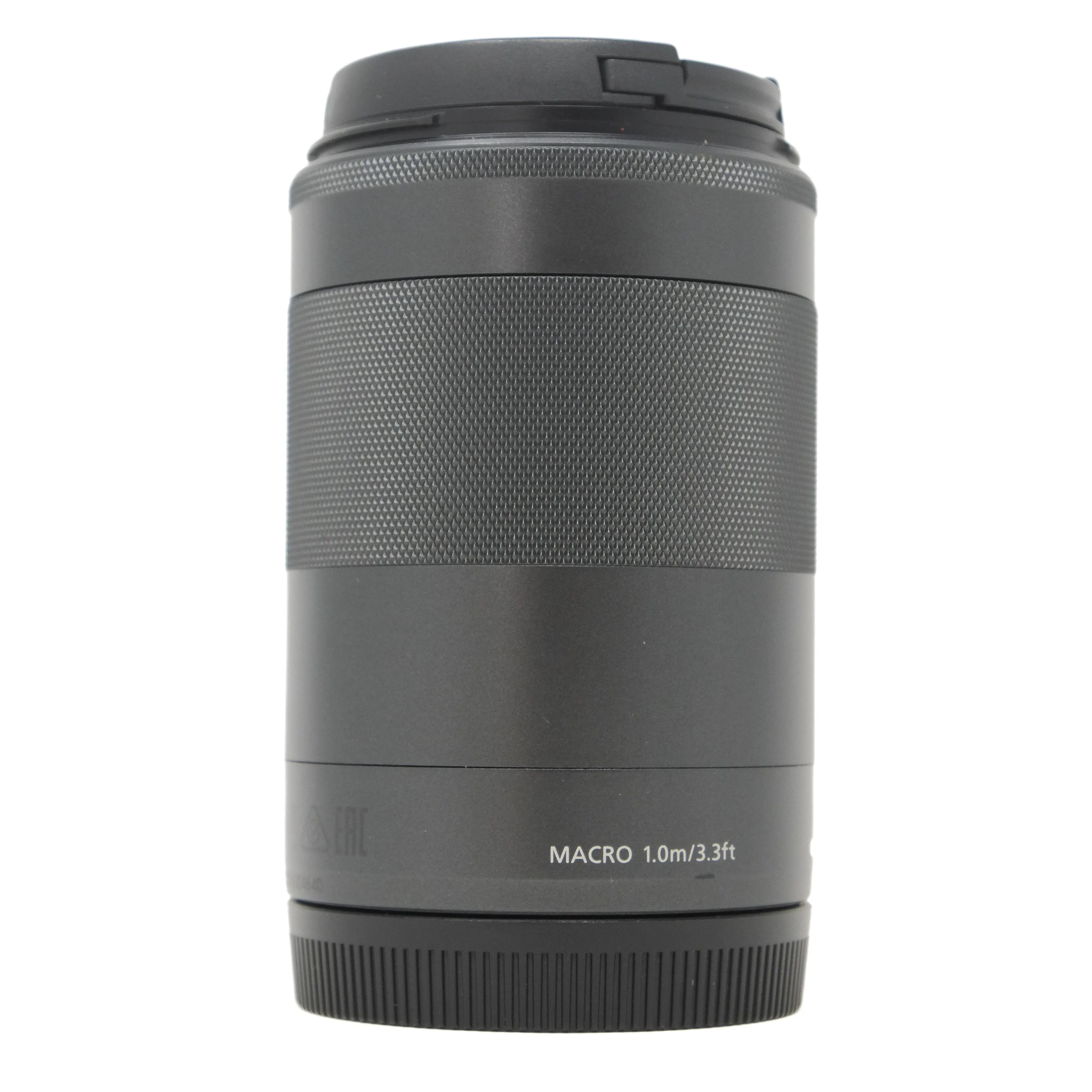 Camera lens with 'MACRO 1.0m/3.3ft' text on a white background
